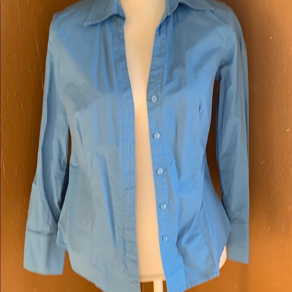 Woman’s button up blouse in pale blue